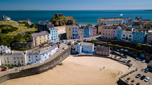 Aerial Drone View Of Colorful Buildings Next To The Ocean In A Picturesque Seaside Town (Tenby, Wales, UK)