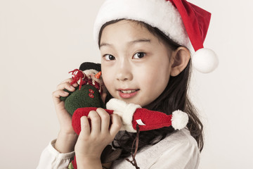 Wall Mural - A asian girl portrait with christmas gift isolated white.