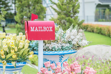 Closeup metal mailbox on garden view textured background