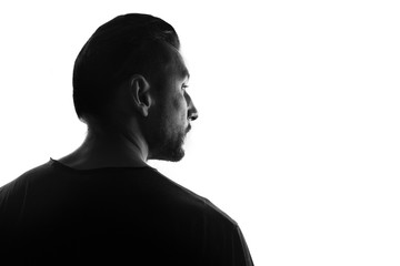 Male person silhouette,back lit over white