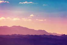 Sunset Over Mountains. Silhouette Of A Mountain Range Against Sky At Sunset