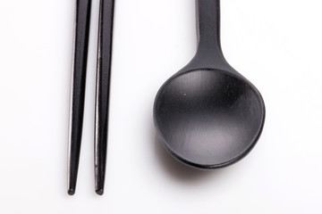 black wood spoon on the white background.