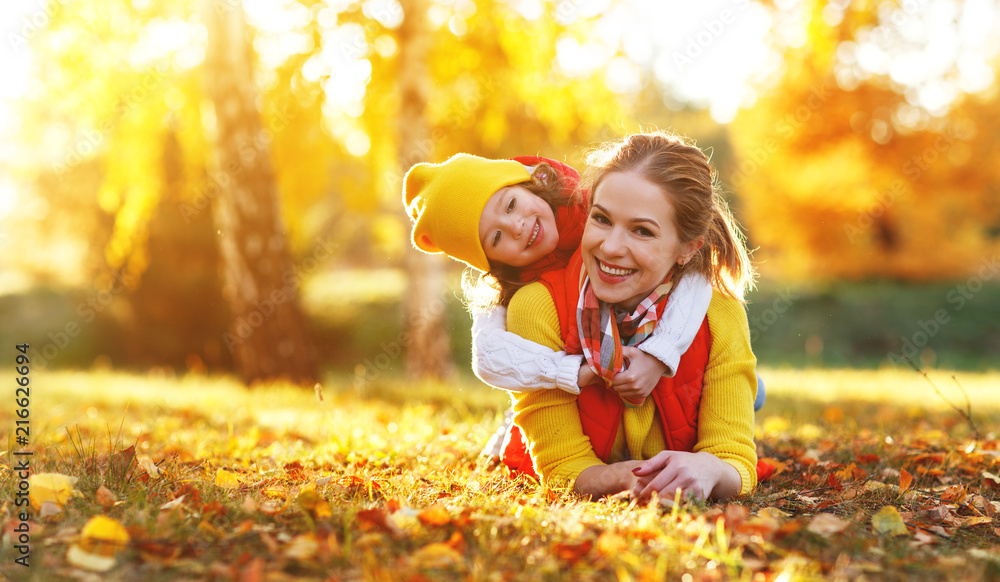 happy family mother and child daughter on   autumn walk - obrazy, fototapety, plakaty 