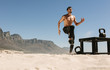 © Jacob Lund - Man doing fitness training at the beach with kettlebells
