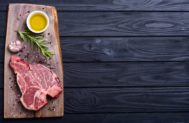 Canvas Print - Raw beef steak T bone with ingredient