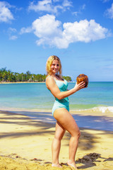 Wall Mural - Girl with coco on the beach