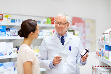 Sticker - medicine, healthcare and people concept - senior apothecary with drugs and female customer at pharmacy