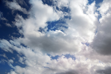 puffy clouds on blue sky