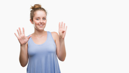 Sticker - Young blonde woman showing and pointing up with fingers number nine while smiling confident and happy.