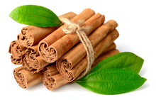Bunch Of Cinnamon Sticks With Fresh Leaves Isolated On The White Background