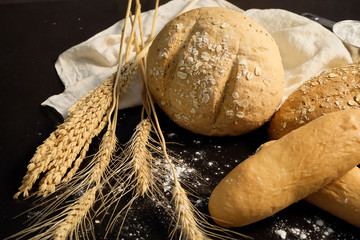 homemade bread on the kitchen table with dark background