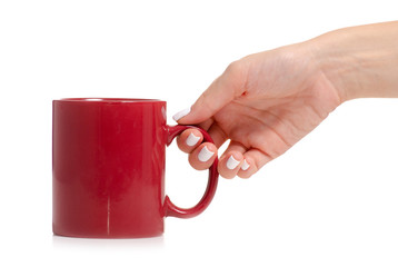 Red mug cup in hand on white background isolation