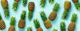 Bright pineapple pattern for minimal style. Top View. Pop art design, creative concept. Copy Space. Banner. Fresh pineapples on blue background.