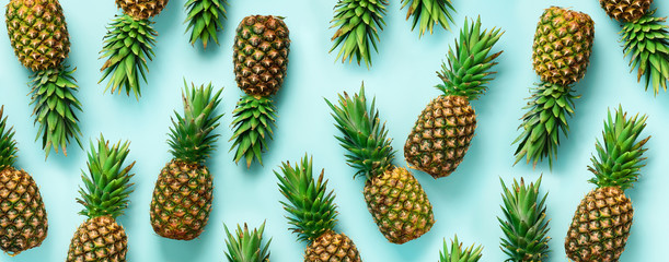 Wall Mural - bright pineapple pattern for minimal style. top view. pop art design, creative concept. copy space. 