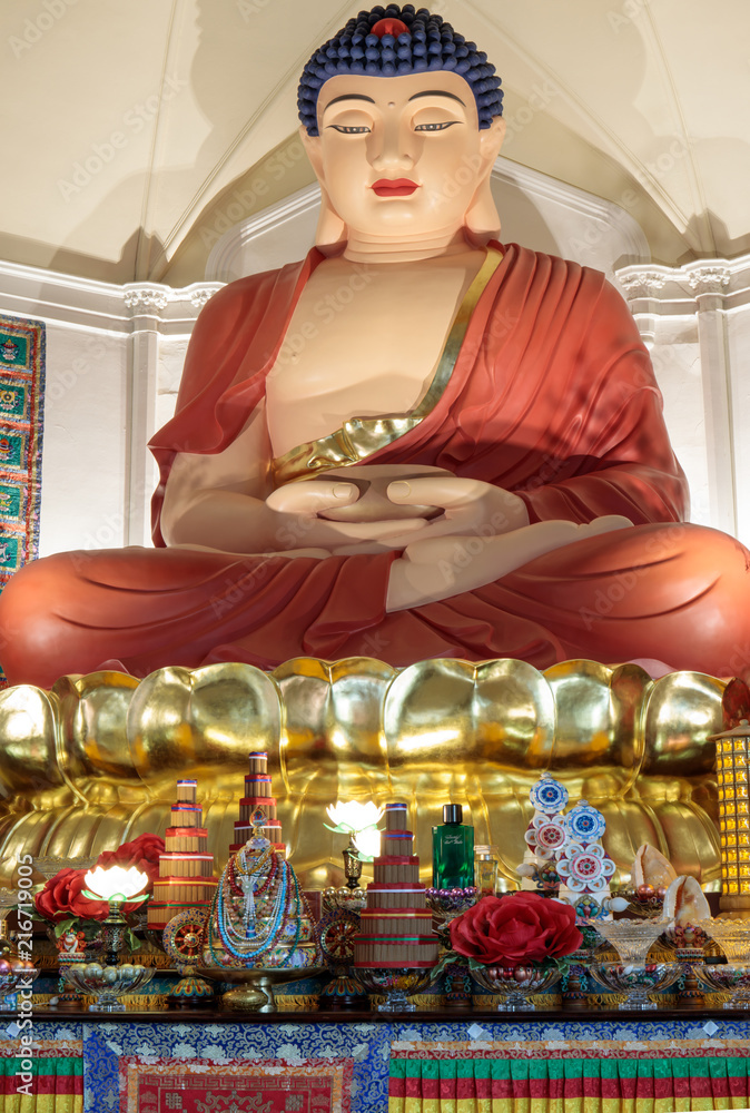 The twenty-one foot high sitting statue of Amitabha Buddha close-up in Hua Zang Si Buddhist Temple. Hua Zang Si in San Francisco is known as the most authentic Buddhist temple in the United States. - obrazy, fototapety, plakaty 