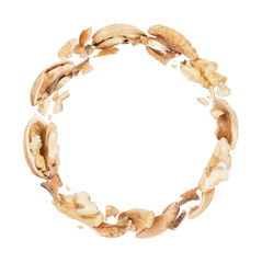 Wall Mural - Crushed walnuts in a circular motion on white background