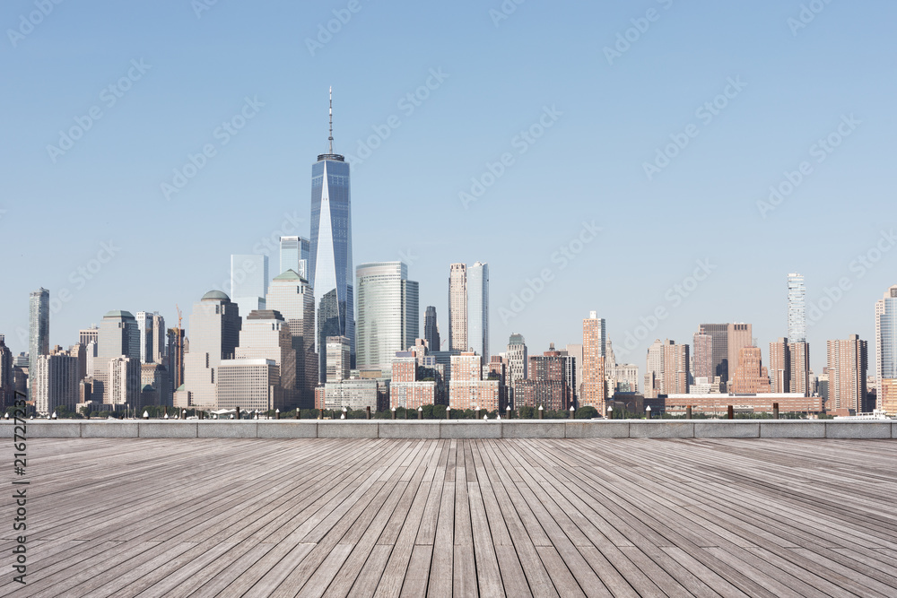 empty street with modern city new york as background - obrazy, fototapety, plakaty 