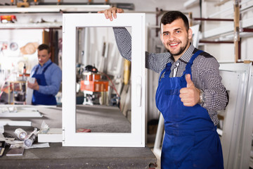 Wall Mural - Workmen inspecting PVC manufacturing output in workshop