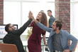 © ASDF - Business people happy showing team work and giving five