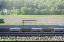 Wooden Bench At The Suburban Railway Station
