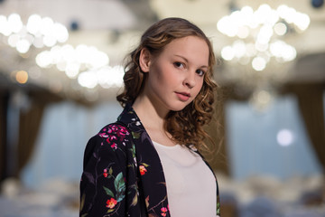 girl stands in the hall