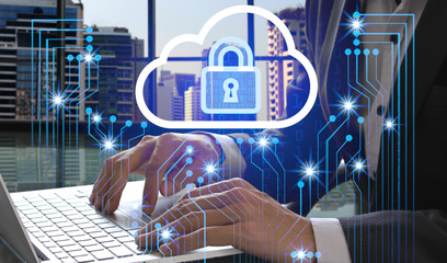 Double exposure of Businessman hand use laptop with padlock technology