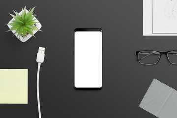 Aufkleber - Smart phone mockup on black office desk.