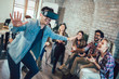 © Mediteraneo - Business people making team training exercise during team building seminar using VR glasses