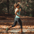 © Microgen - Woman Jogging Outdoors in The Fall