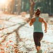 © Microgen - Woman Jogging Outdoors in The Fall