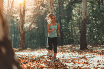 Woman Jogging Outdoors in The Fall