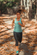 © Microgen - Woman Jogging Outdoors in The Fall