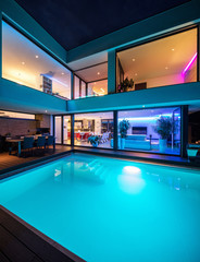 Modern villa with colored led lights at night