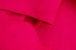 © butus - red bright fabric texture from a piece of cloth on clothes