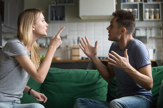 angry millennial couple arguing shouting blaming each other of problem, frustrated husband and annoy