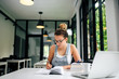 © bnenin - College girl doing assignment in modern enviroment.
