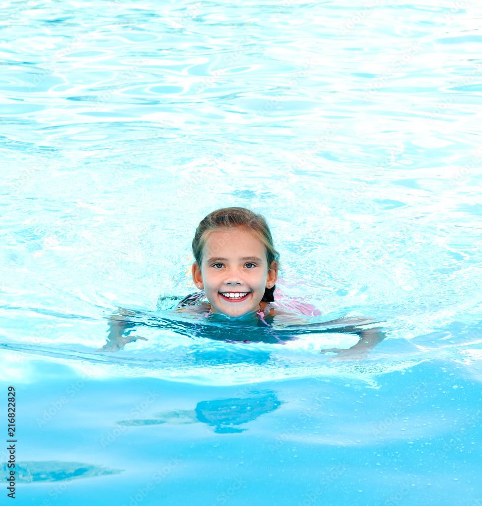 Cute smiling happy little girl child in swimming pool Stock Photo ...