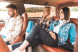 © LIGHTFIELD STUDIOS - happy group of friends sitting in car while having trip