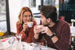 © zinkevych - Coffee time. Beautiful adorable couple sipping coffee and chatting