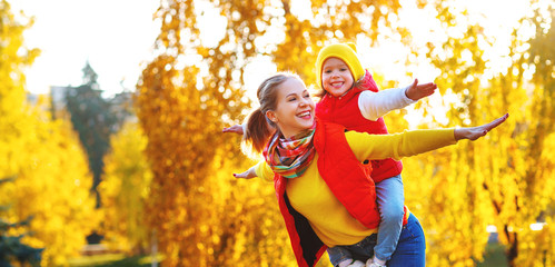 Poster - happy family mother and child daughter on   autumn walk .