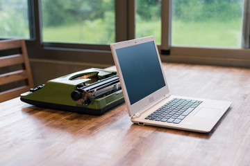 typewriter and laptop