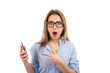 © Feodora - Casual girl wearing blue shirt and looking shocked and amazed pointing at cellphone
