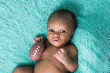 Wall Mural - Newborn Baby Boy with Football