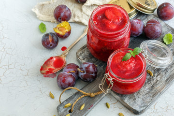 Wall Mural - Homemade plum jam in glass jars.