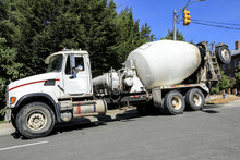 Heavy Concrete Truck On Construction Site Against Blue Sky