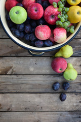 Wall Mural - Spelled autumn fruits on a wooden background