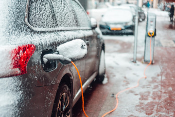 Electric car plug charging in the winter