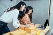 © jumlongch - Two young asian woman are freelancer with her private online business at home office, working with online marketing.