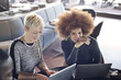 © Andy Paul - Two business women using laptops
