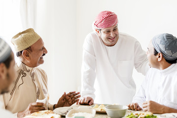 Wall Mural - Muslim men celebrating ending of Ramadan